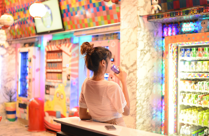 Woman in front Japanese vending machines