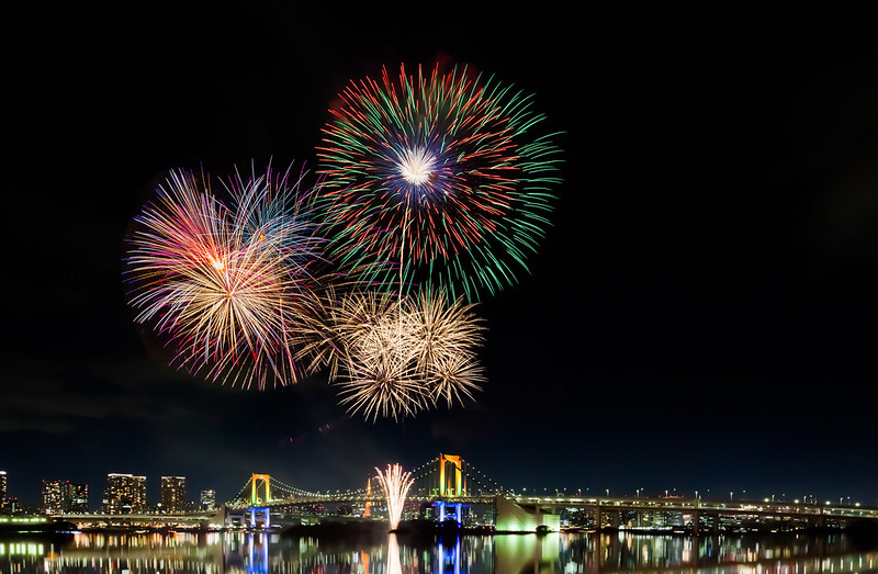 Tokyo fireworks at Tokyo bay and Rainbow bridge at night.