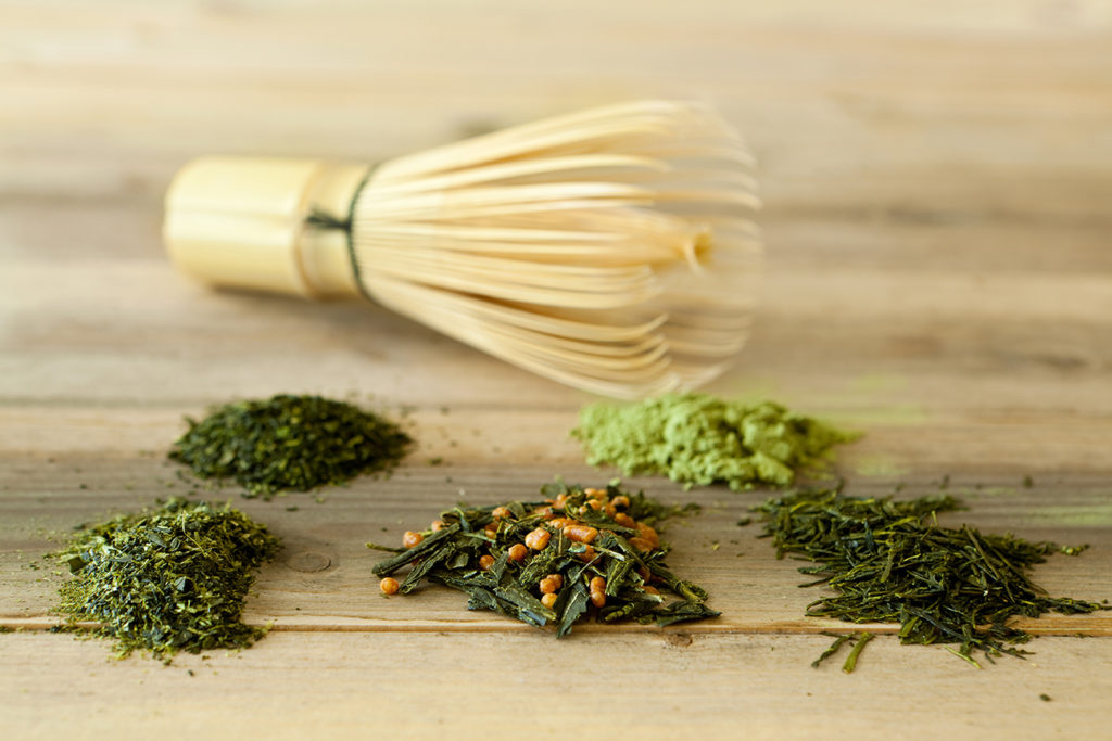 Different kinds of tea with bamboo whisk